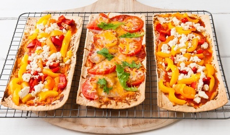 Baked flatbread with variety of toppings.